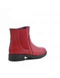 Red girl's boot in faux leather with elastic panel