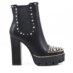 Boot with studs and heel